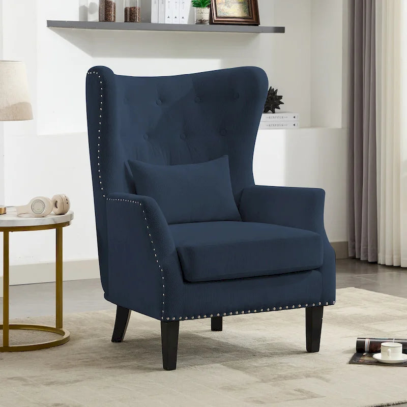 Fauteuil à oreilles en velours côtelé et clous tapissiers classiques