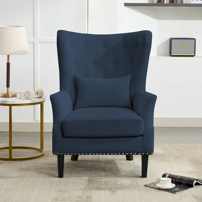 Fauteuil à oreilles en velours côtelé et clous tapissiers classiques