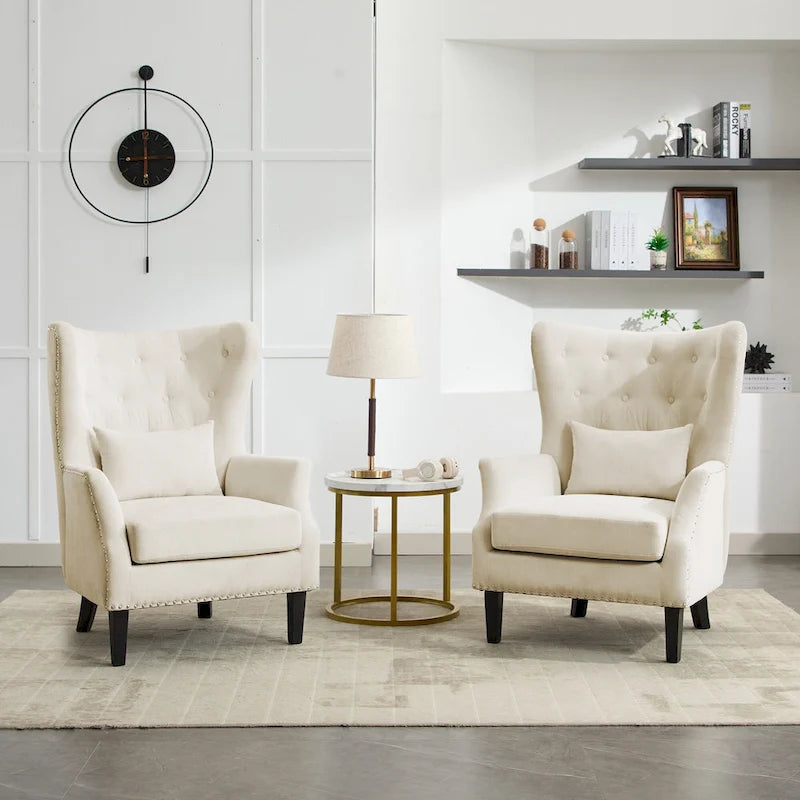 Fauteuil à oreilles en velours côtelé et clous tapissiers classiques