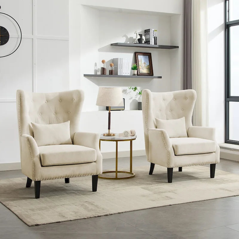 Fauteuil à oreilles en velours côtelé et clous tapissiers classiques